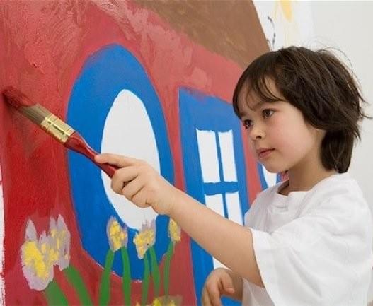 Child painting a house. Child painting a house.