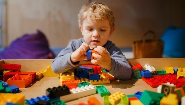Child playing with Lego. Child playing with Lego.