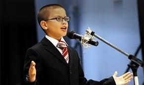 Young child performing on stage. Young child performing on stage.