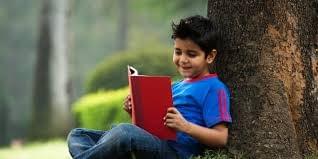 Boy reading a book. Boy reading a book.