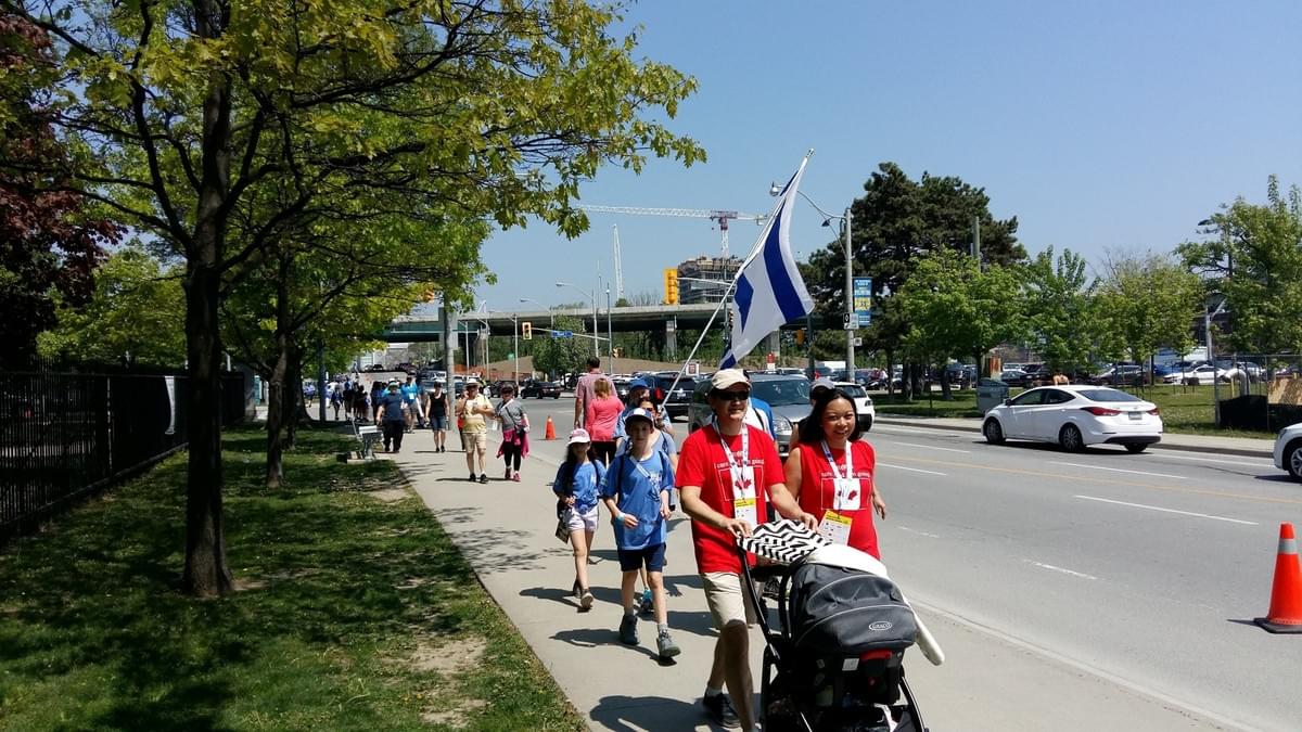 Walkekrs pass by the Israel Truth Week 'Jews are owners!' cheerleading station near the end of the Walk With Israel, Toronto, May 27/18. Walkekrs pass by the Israel Truth Week 'Jews are owners!' cheerleading station near the end of the Walk With Israel, Toronto, May 27/18.