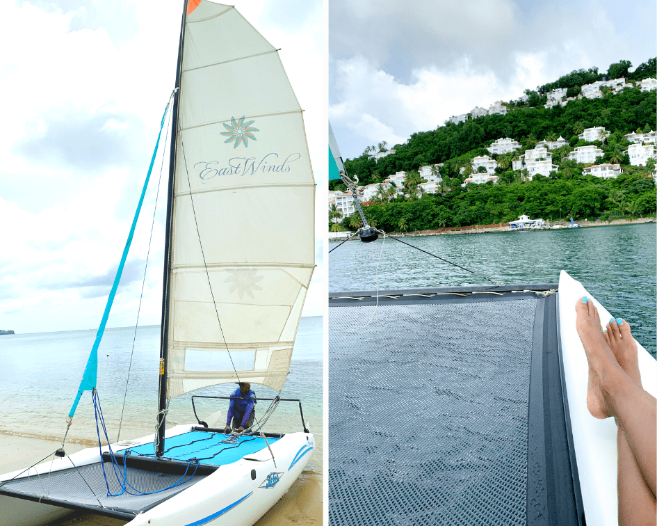 Small East Winds sailboat on the beach and feet resting on a boat off the St Lucia bay in the Caribbean Sea Small East Winds sailboat on the beach and feet resting on a boat off the St Lucia bay in the Caribbean Sea
