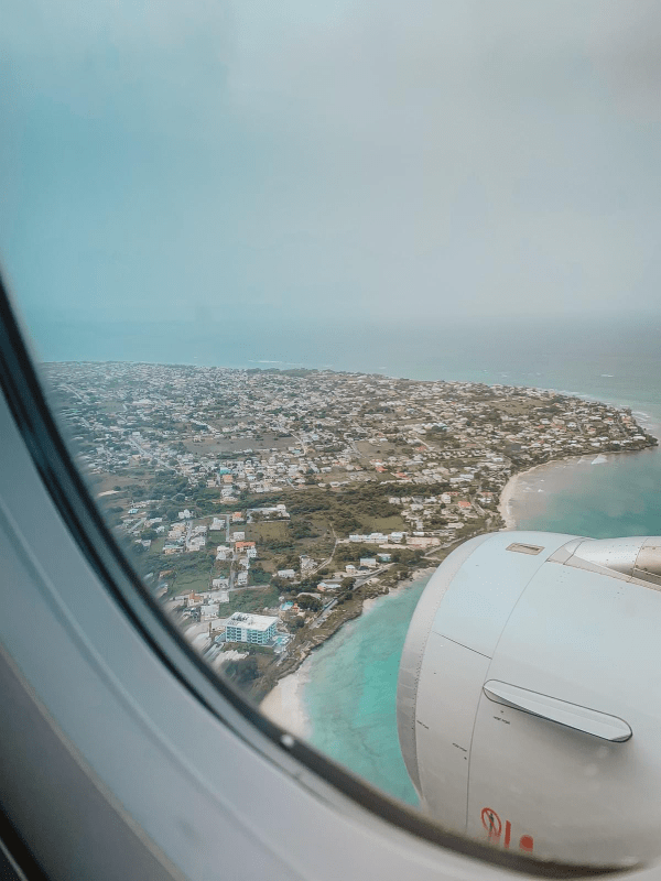 Aerial view of Barbados island from a landing airplane with the ocean and land Aerial view of Barbados island from a landing airplane with the ocean and land