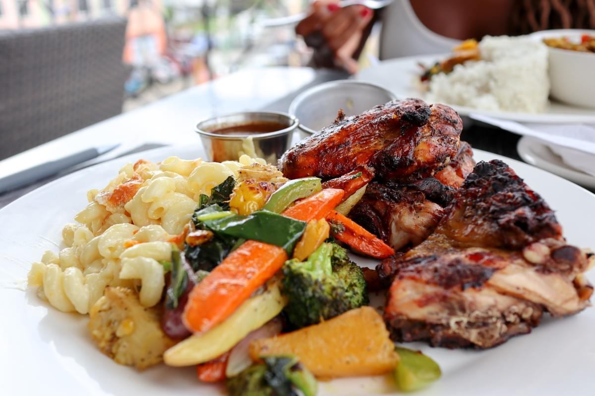 Traditional Caribbean recipes of vegetables, macaroni salad, and chicken from Matthew's Rooftop Restaurant in Castries in Saint Lucia Traditional Caribbean recipes of vegetables, macaroni salad, and chicken from Matthew's Rooftop Restaurant in Castries in Saint Lucia