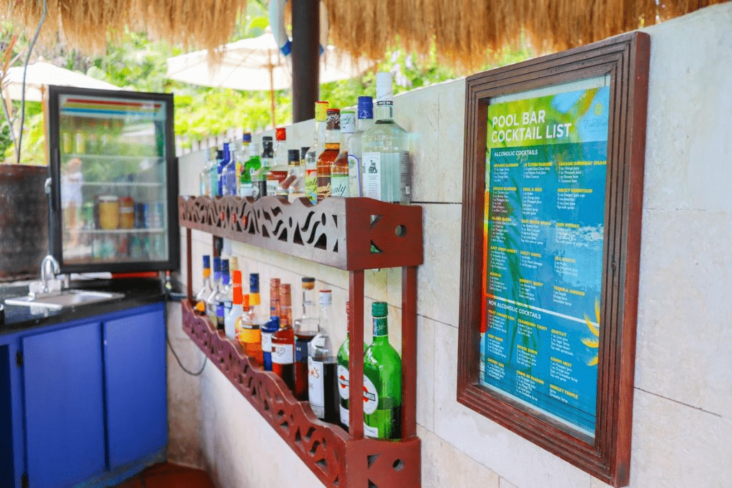 Saint Lucia all inclusive beach resort East Winds has a poolside wet bar with liquor and posted cocktail list Saint Lucia all inclusive beach resort East Winds has a poolside wet bar with liquor and posted cocktail list