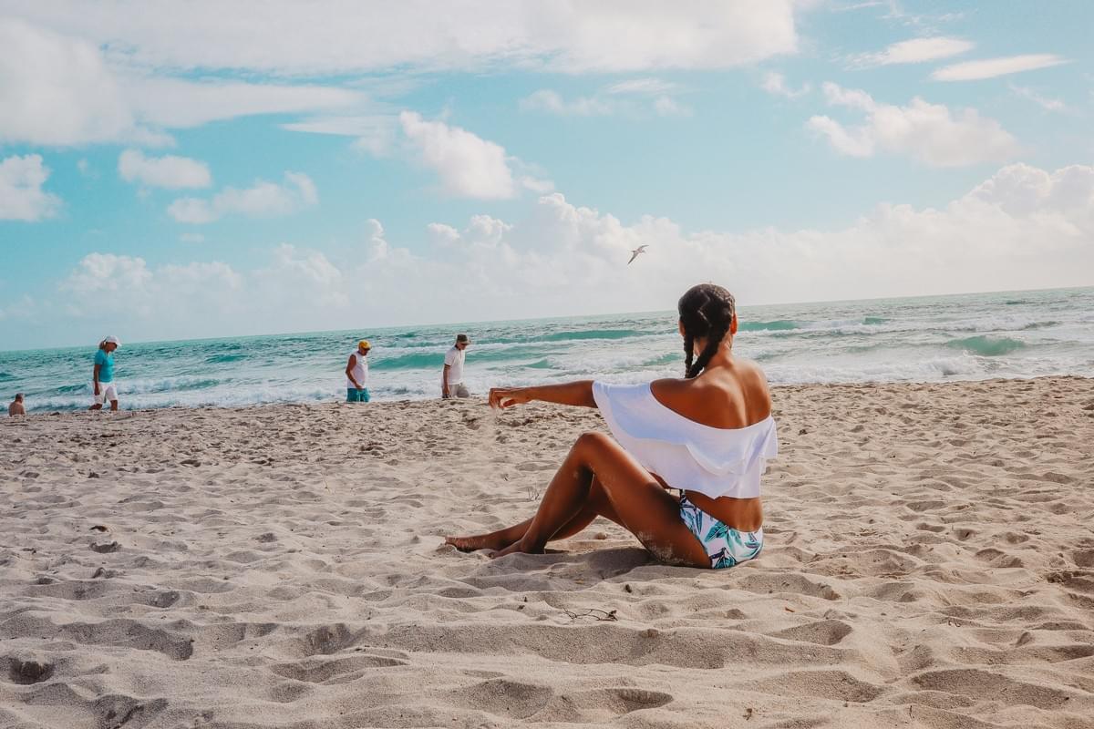 Braided hair girl on a sandy beach Braided hair girl on a sandy beach