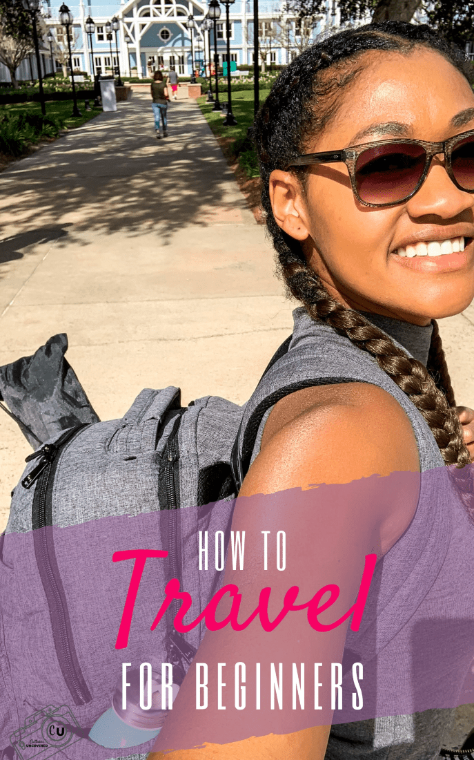 How to travel for beginners with black girl holding a camera of herself in a car mirror with yellow street sign and nature How to travel for beginners with black girl holding a camera of herself in a car mirror with yellow street sign and nature