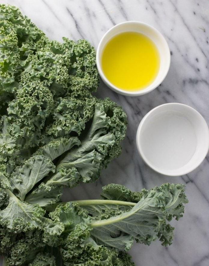 Kale, oil, vinegar, and salt are the only ingredients needed for a delicious, healthy snack Kale, oil, vinegar, and salt are the only ingredients needed for a delicious, healthy snack