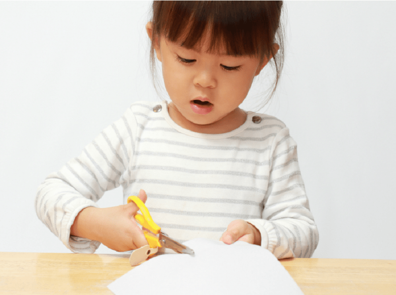 snipping paper with scissors snipping paper with scissors