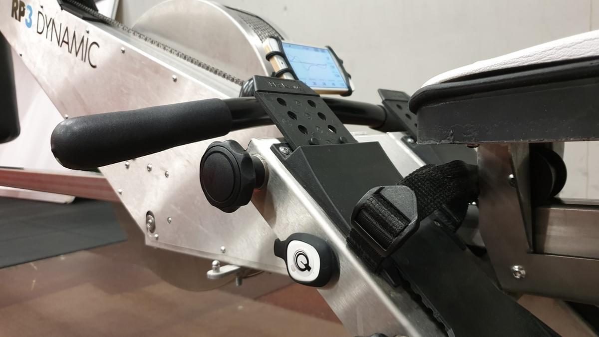 On the RP3 the Quiske pod can be attached to the side of the frame or between the feet. Make sure the blade on the sticker points towards the rower On the RP3 the Quiske pod can be attached to the side of the frame or between the feet. Make sure the blade on the sticker points towards the rower
