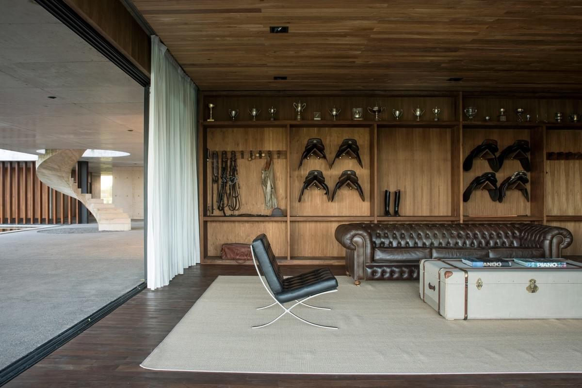 Stunning concrete stables features grassy roof for horses to graze Estudio Ramos Stunning concrete stables features grassy roof for horses to graze Estudio Ramos