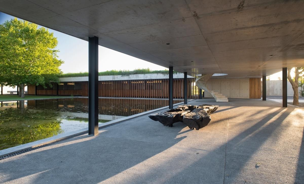 Stunning concrete stables features grassy roof for horses to graze Estudio Ramos Stunning concrete stables features grassy roof for horses to graze Estudio Ramos