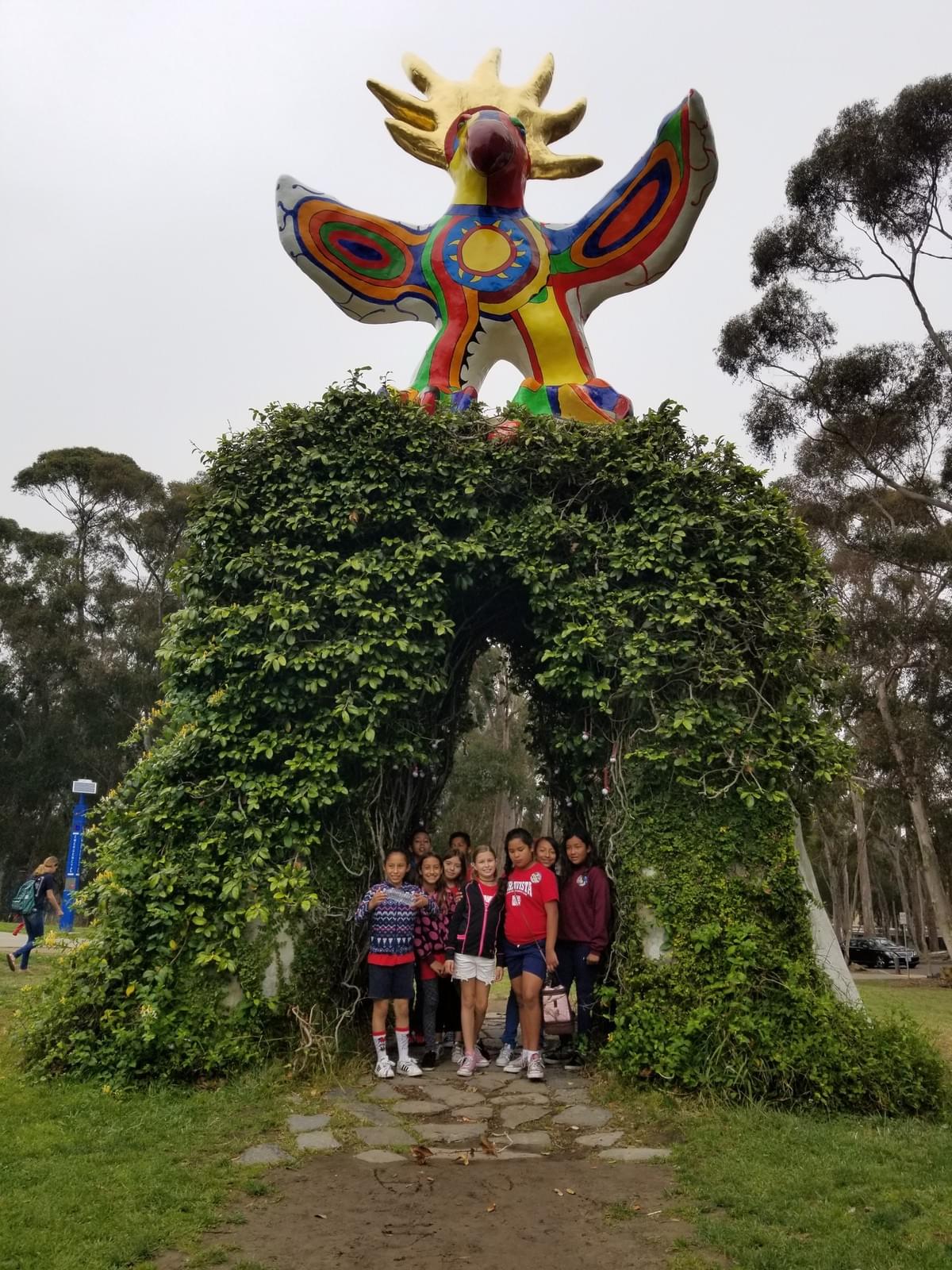 Chavez Elementary students standing under UCSD statue Chavez Elementary students standing under UCSD statue