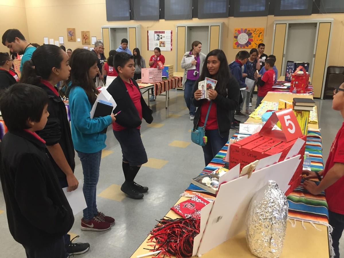 Students show off their reading presentations at school fair Students show off their reading presentations at school fair