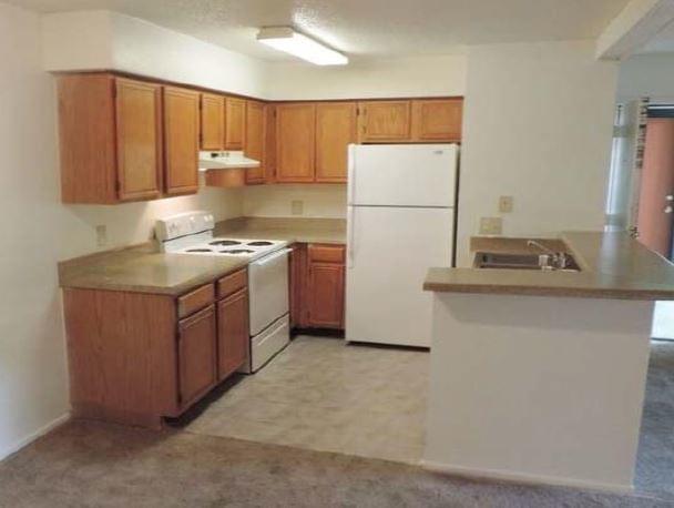 Class C example with white appliances and carpet Class C example with white appliances and carpet