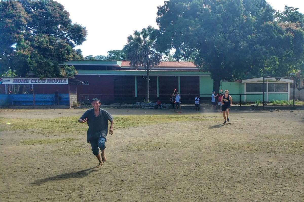 Local teenagers taking part in running relays during a Quetzaltrekekrs sport session on a baseball field in León, Nicaragua Local teenagers taking part in running relays during a Quetzaltrekekrs sport session on a baseball field in León, Nicaragua