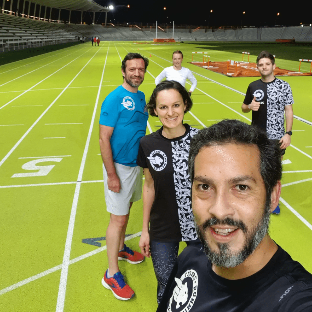A group of runners pose for a photo during a track session at Estadio Vallehermoso, Madrid A group of runners pose for a photo during a track session at Estadio Vallehermoso, Madrid