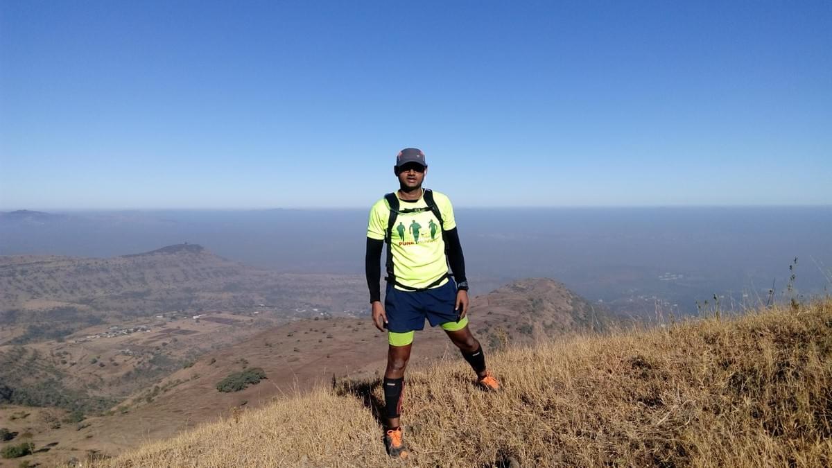 trail runner poses for photo during trail run in pune india trail runner poses for photo during trail run in pune india