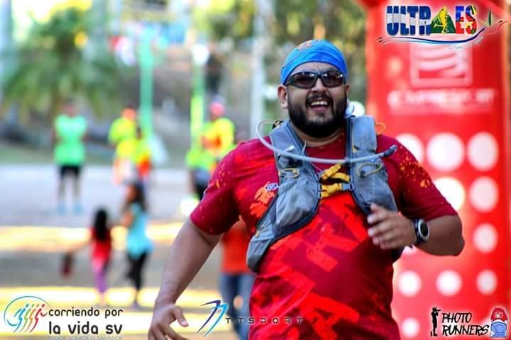 a runner crosses the finish line at an ultra trail running race in el salvador a runner crosses the finish line at an ultra trail running race in el salvador