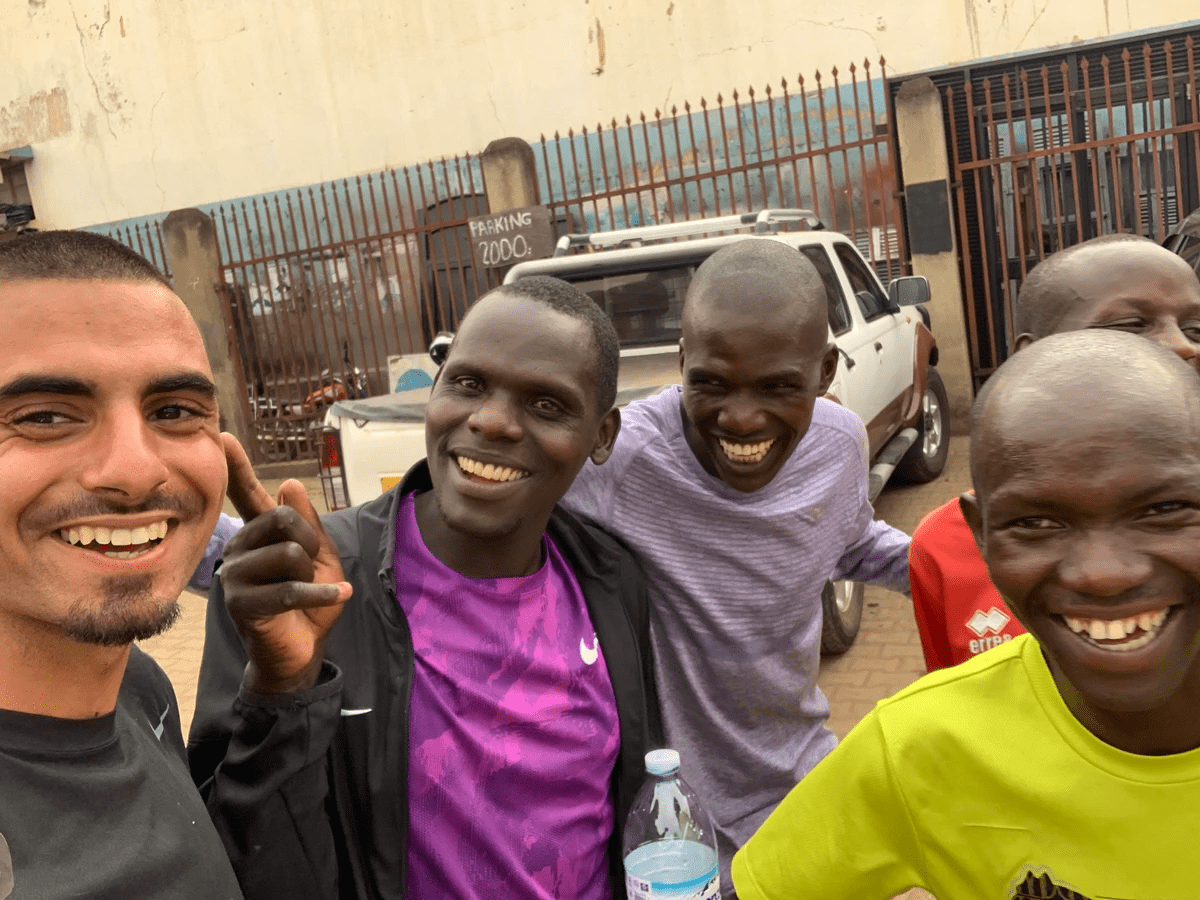a group of ugandan elite athletes and coaching staff laugh during a photo a group of ugandan elite athletes and coaching staff laugh during a photo