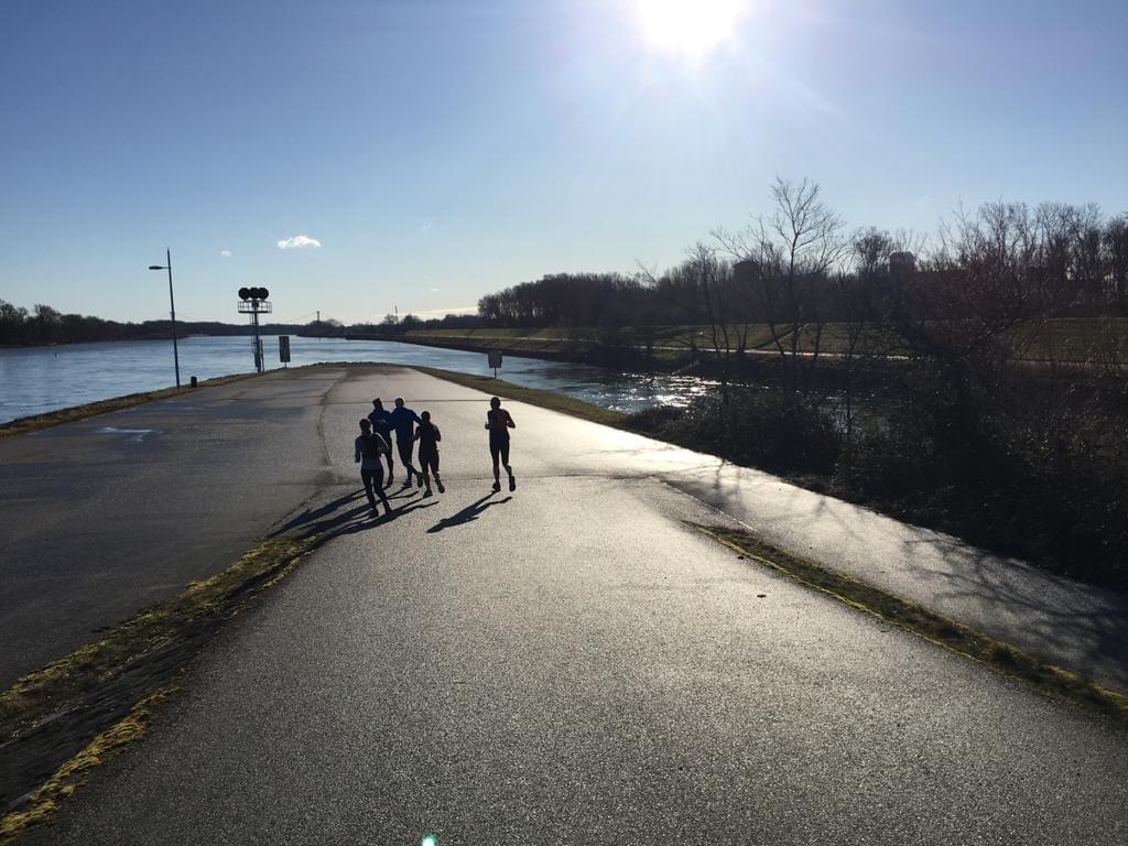 Running group on a run in Vienna, Austria where Danube and the Danube Canal meet Running group on a run in Vienna, Austria where Danube and the Danube Canal meet