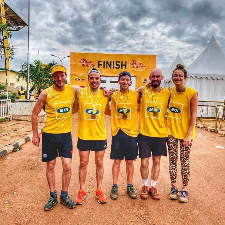 runners celebrate receiving their medal at the 2019 MTN marathon finish in Kampala runners celebrate receiving their medal at the 2019 MTN marathon finish in Kampala