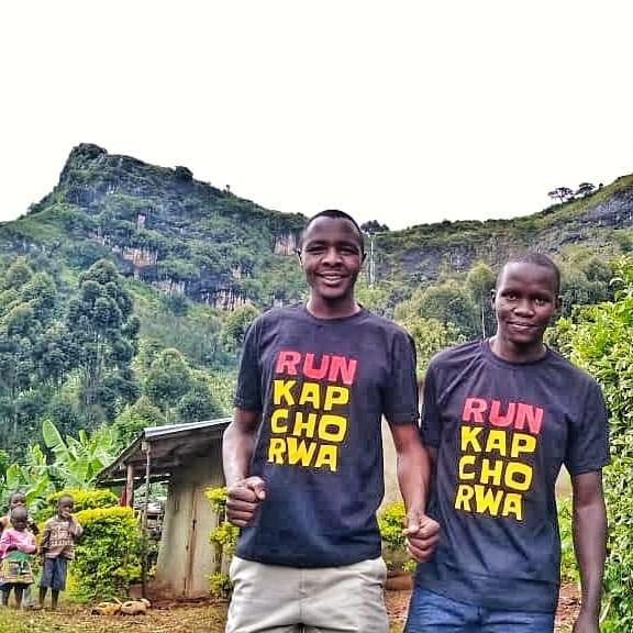 run kapchorwa team in on mount elgon in front of waterfall run kapchorwa team in on mount elgon in front of waterfall