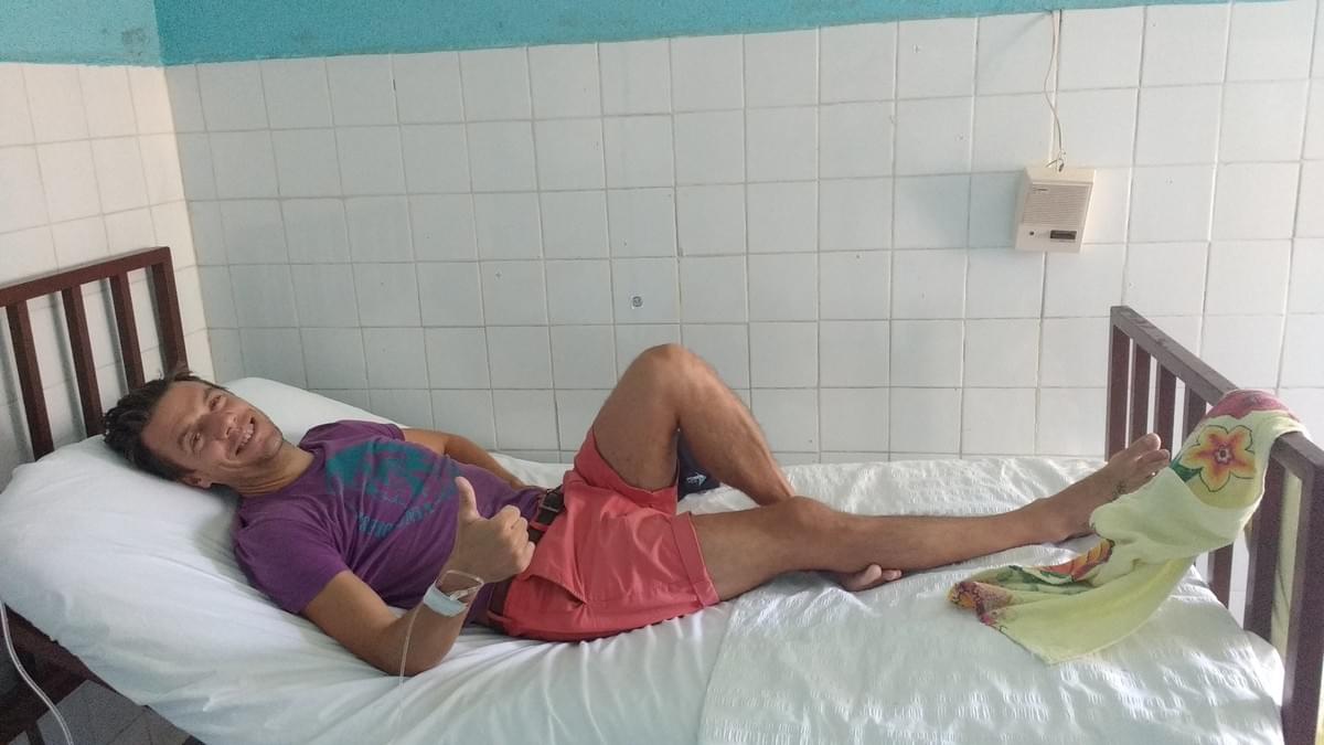 Lying on a hospital bed in Peten, Guatemala. Drip in arm. Lying on a hospital bed in Peten, Guatemala. Drip in arm.