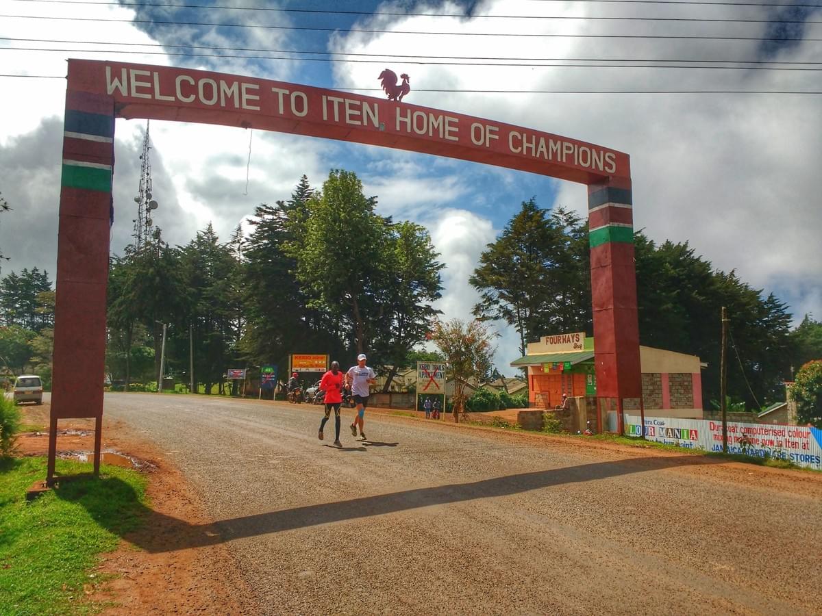 Running under the 'Home of Champions' arch in Iten, Kenya Running under the 'Home of Champions' arch in Iten, Kenya