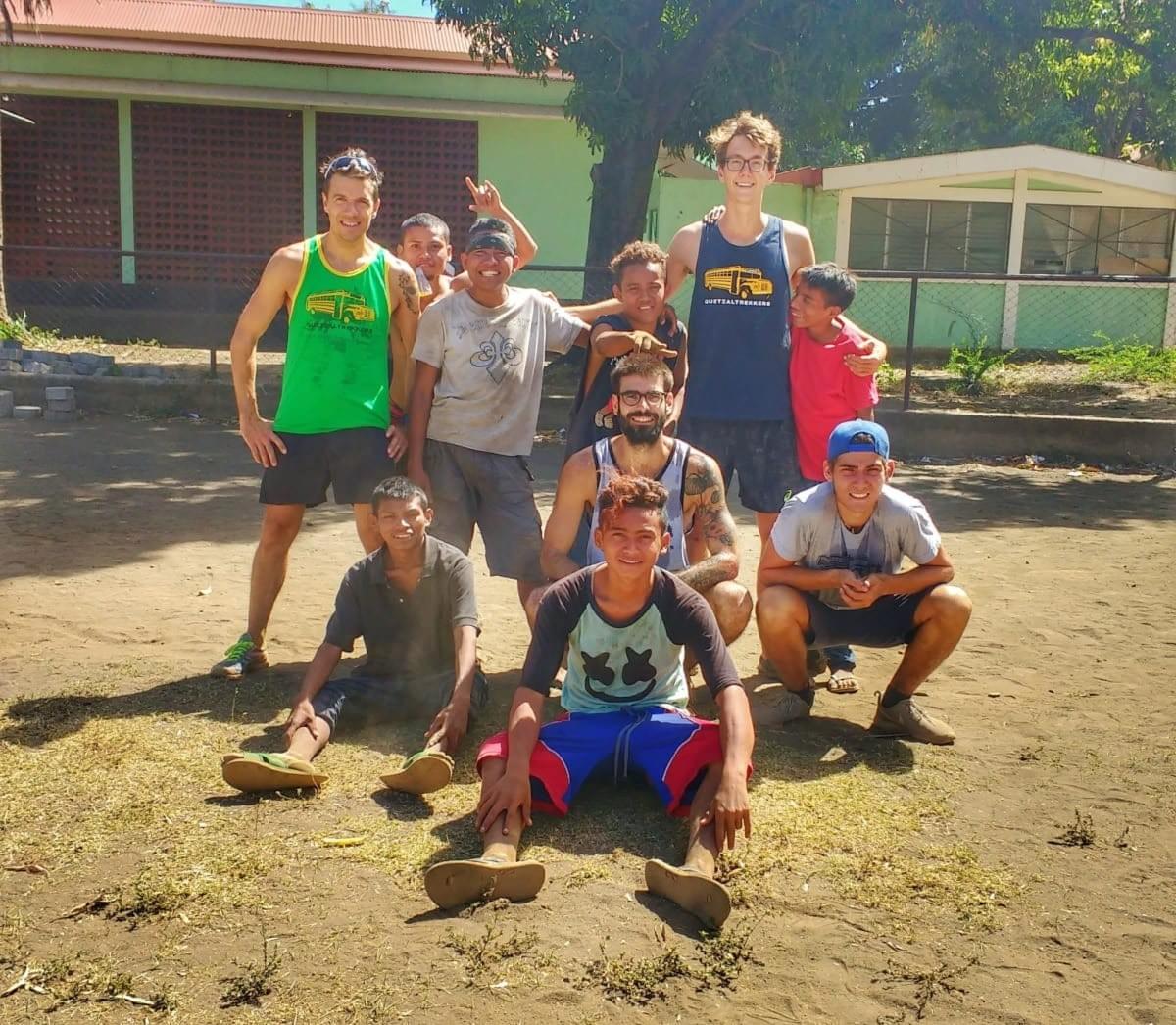 Group photo of Quetzaltrekkers team and local youths after football match Group photo of Quetzaltrekkers team and local youths after football match