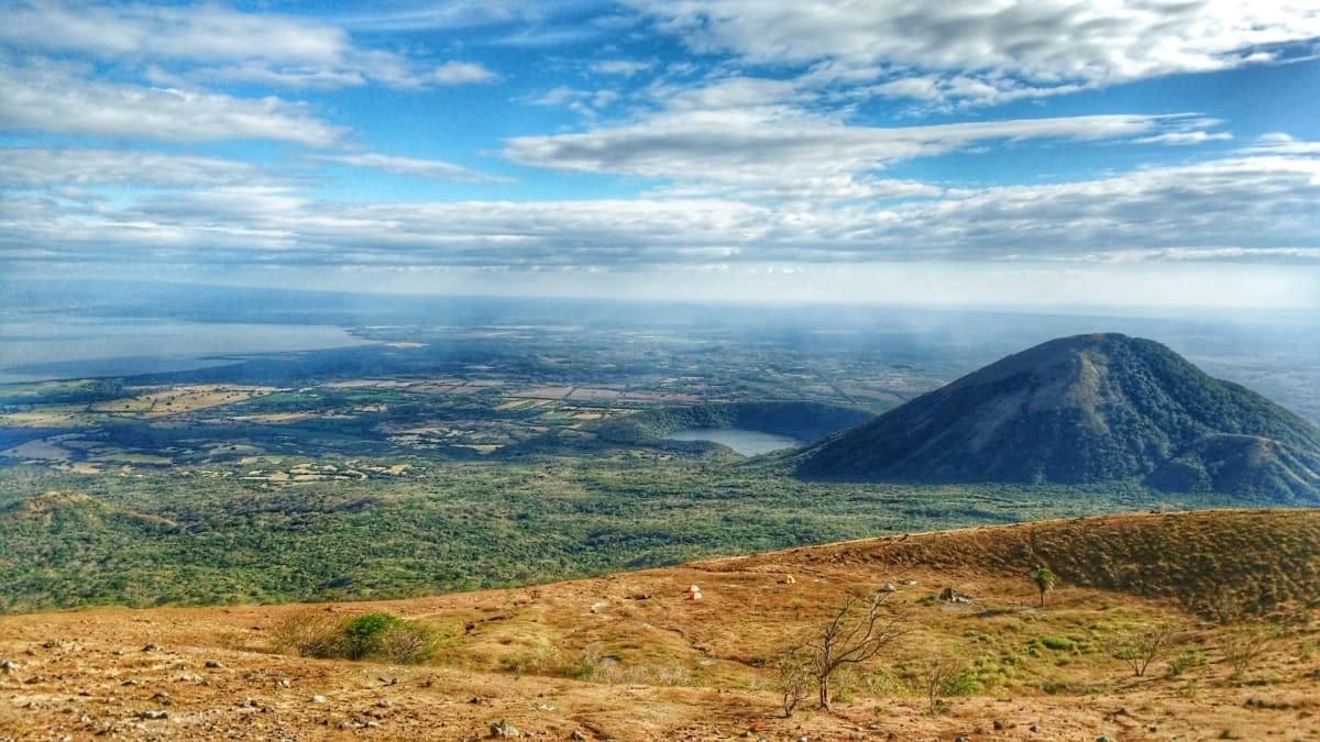 The Quetzaltrekkers campsite in a volcanic crater with incredible views of volcano and laguna The Quetzaltrekkers campsite in a volcanic crater with incredible views of volcano and laguna