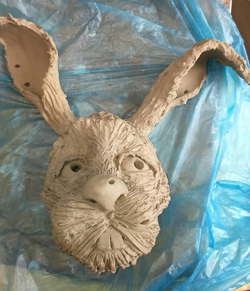 Wall hanging rabbit with piercings, waiting to air dry before firing Wall hanging rabbit with piercings, waiting to air dry before firing
