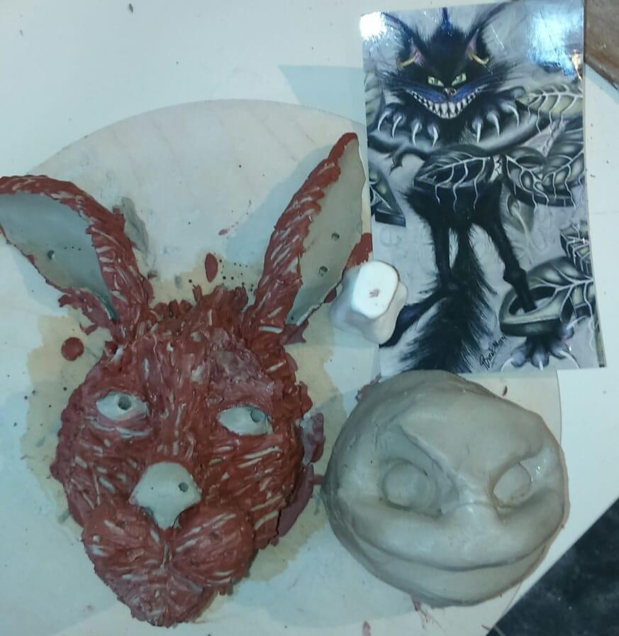 Rabbit coated with brown slip and beginnings of Cheshire cat. Both small wall hangings when finished Rabbit coated with brown slip and beginnings of Cheshire cat. Both small wall hangings when finished