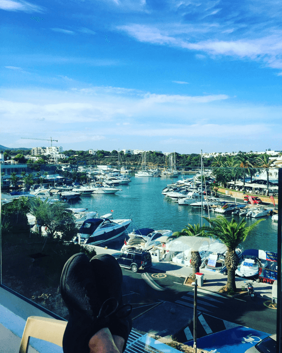 Aerial view of port city with ships and coastline
