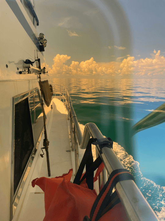Inside view of a boat with marine equipment and sunset