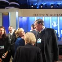 HIllary Clinton discussing with a CGI guest