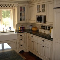 We painted & applied a glaze on the cabinets, for a distressed look, using Benjamin Moore Paints.