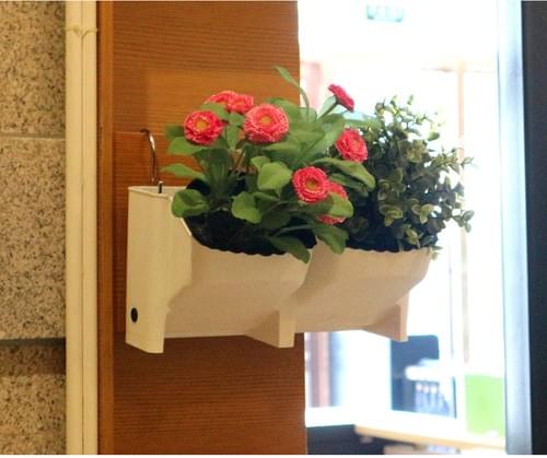 plastic hang up on wall self watering plant pots