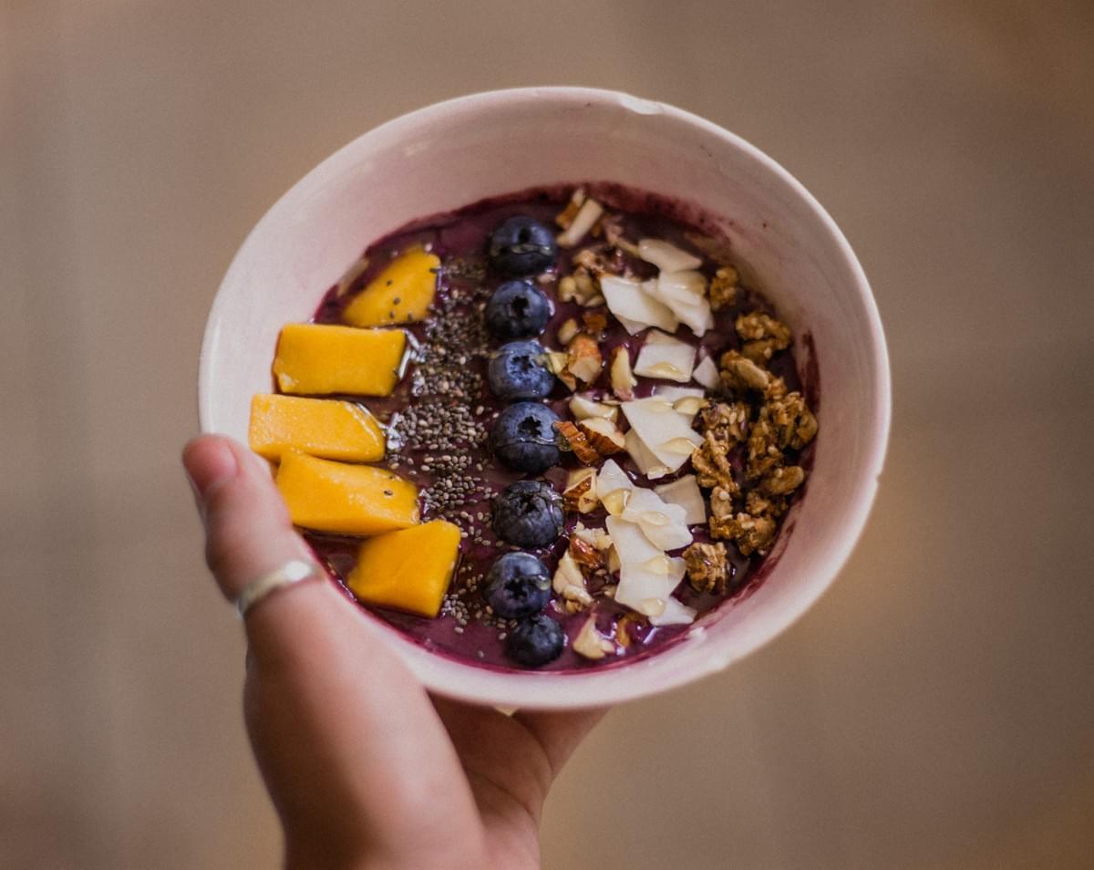 Smoothie bowl with fruit and granola topping