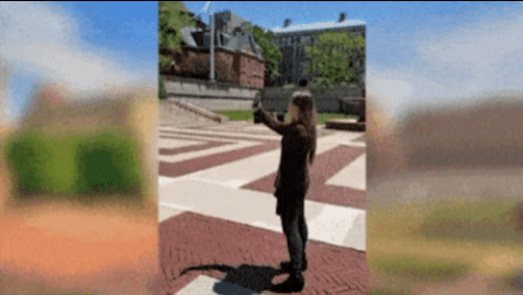 gif demonstrating an AR tour. A young woman stands in front of a large library building, holding up her phone. The image then changes to show her phone, where an AR tour featuring a story and an AR portal are enabled