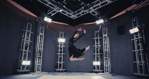 gif demonstrating an AR video. A phone screen shows a set of stairs, in front of which is an AR popup of a video giving information about the site