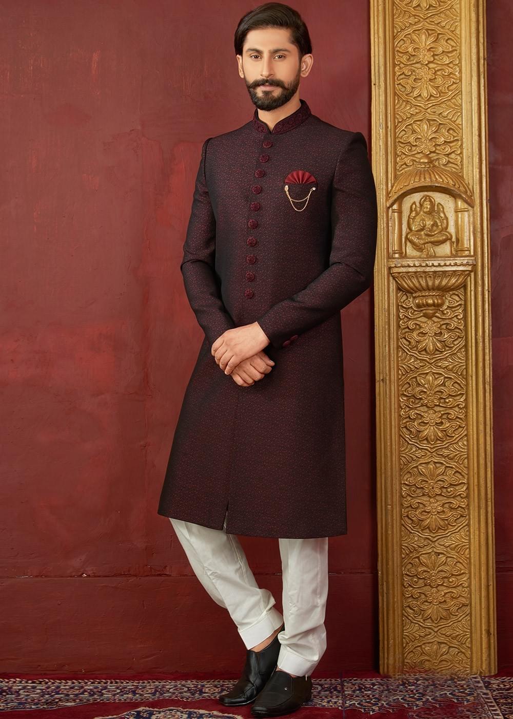 Designer Sherwani Makes Bridegroom Standout On His Wedding Day Significant collar, cuffs, front panel, shoulder is embellished with glossy beads, diamantes, jardozy and stone work combined with piping pattern is adding a lot to its style. designer sherwani makes bridegroom