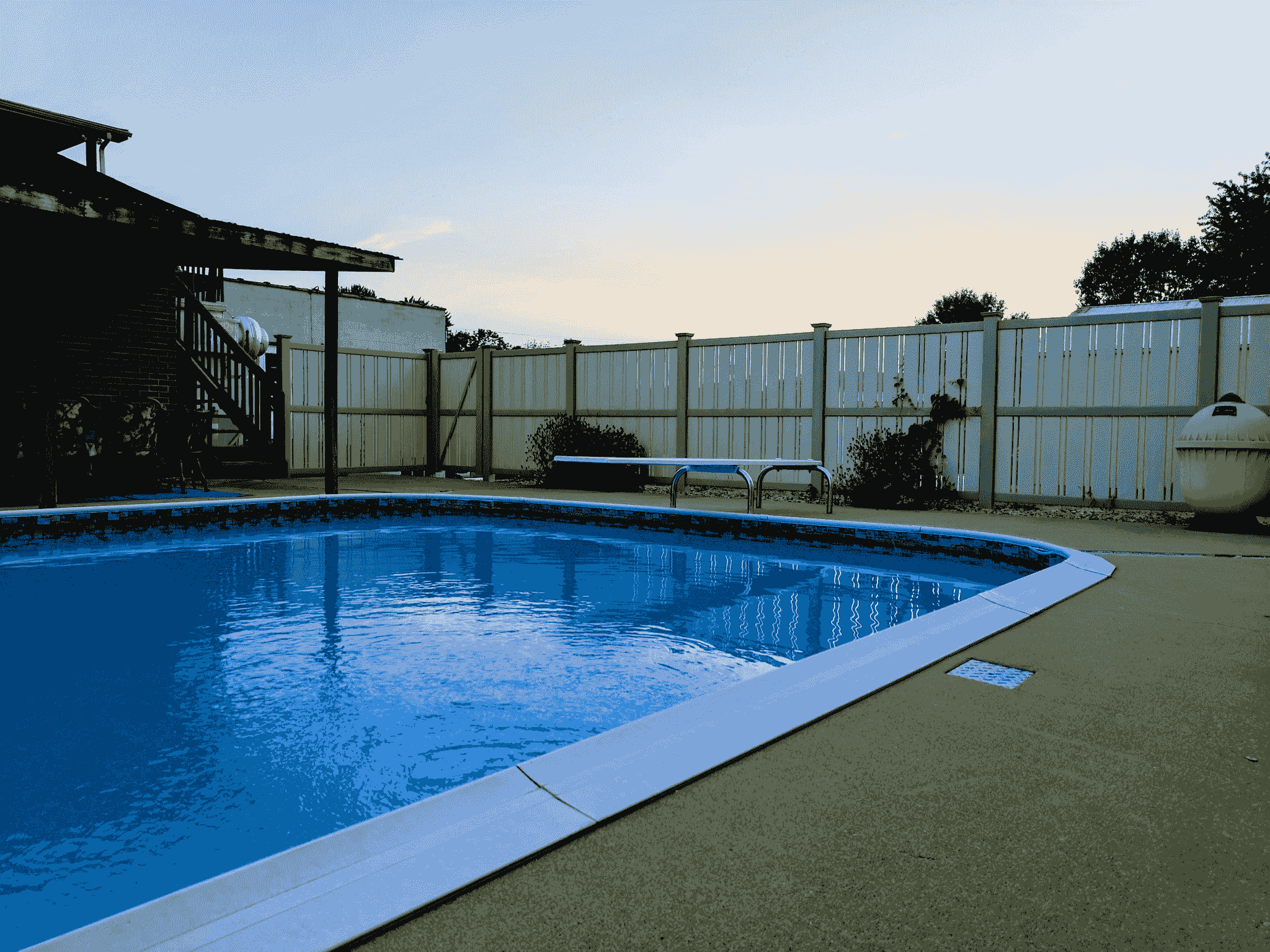 Stylish timber pool fencing enhancing safety around swimming area.