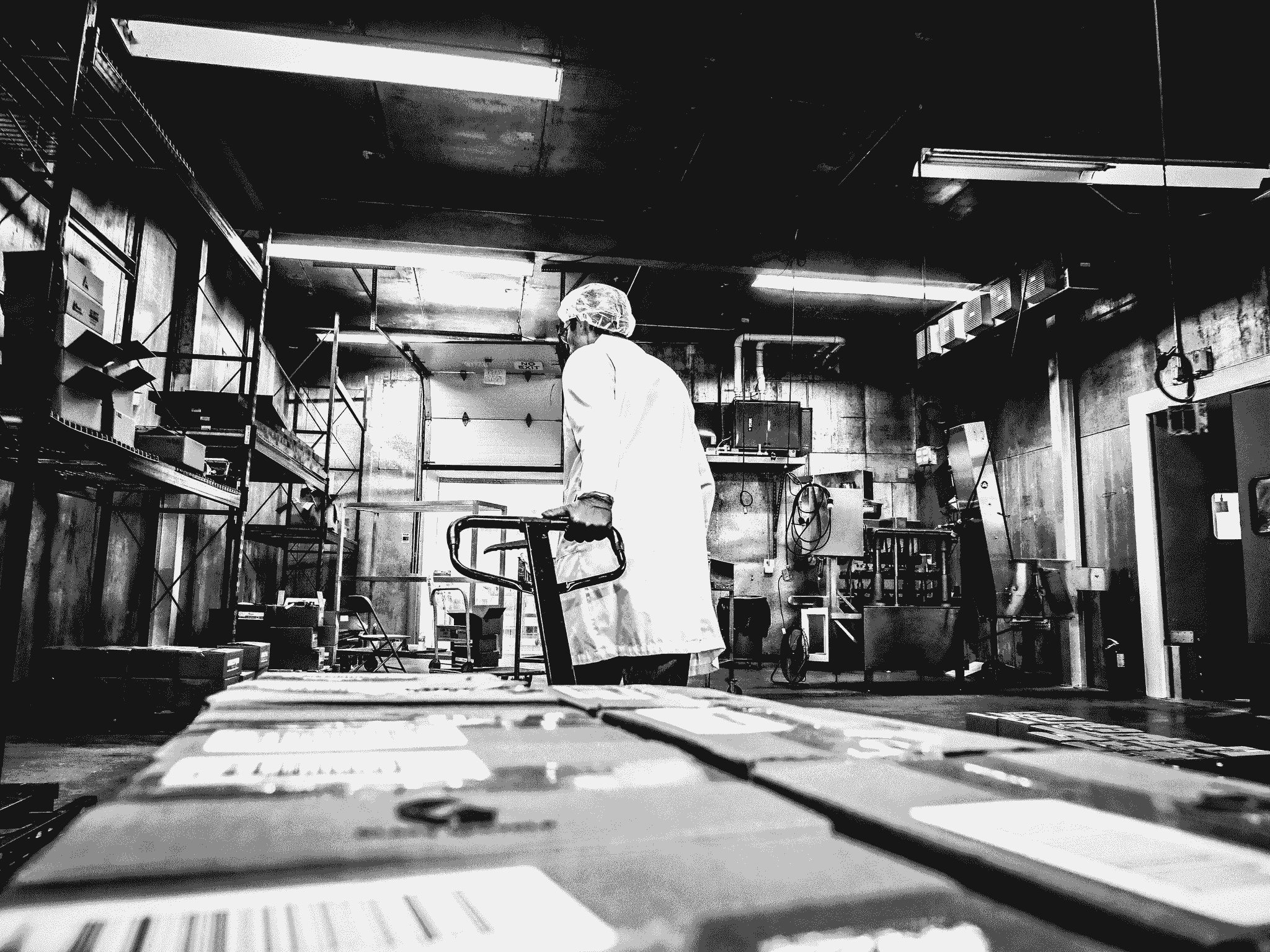 Quality inspection services China: Inspector examining product at manufacturing facility