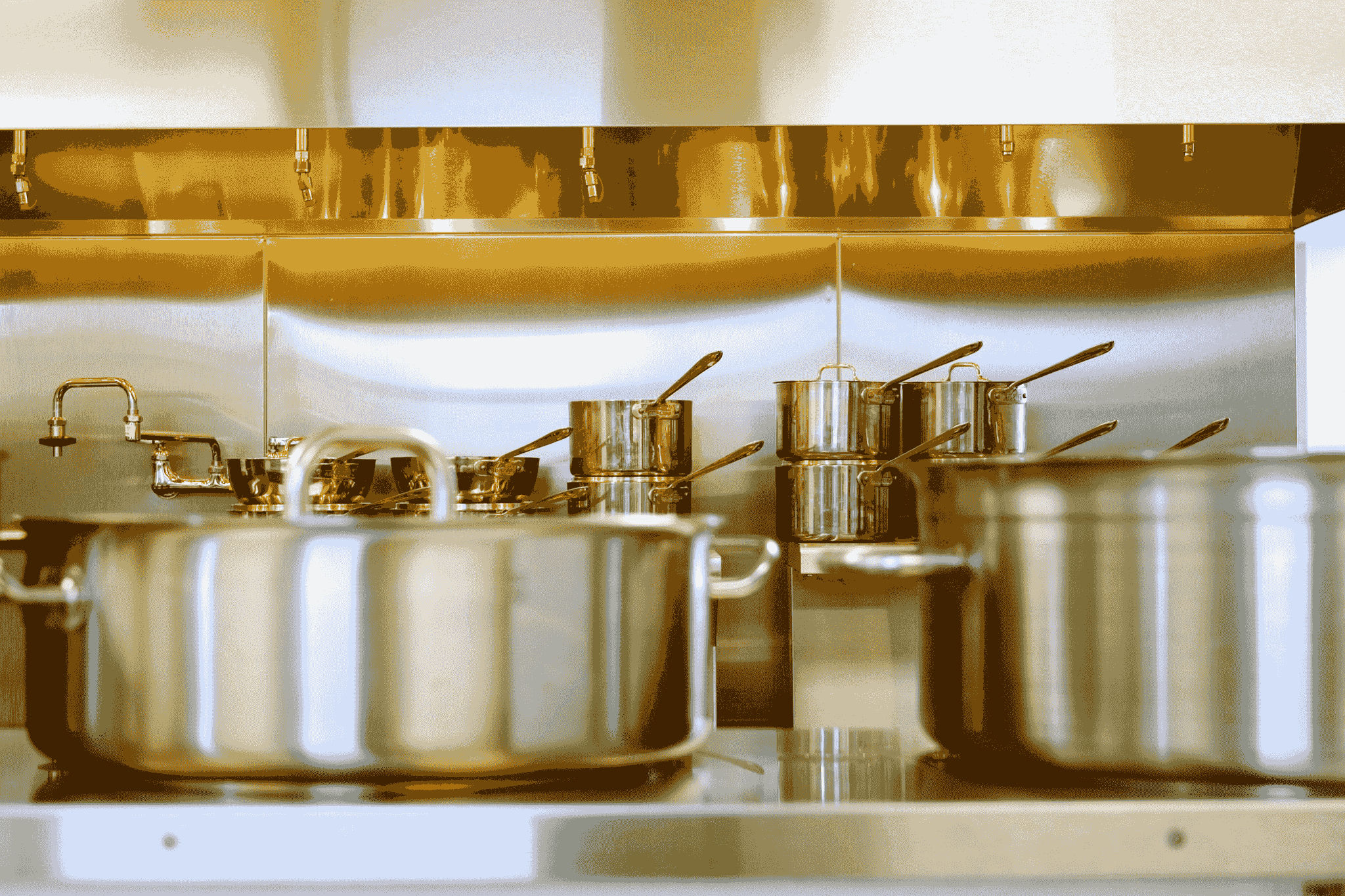Hotel equipment supplies - Stainless steel pots and pans in commercial kitchen