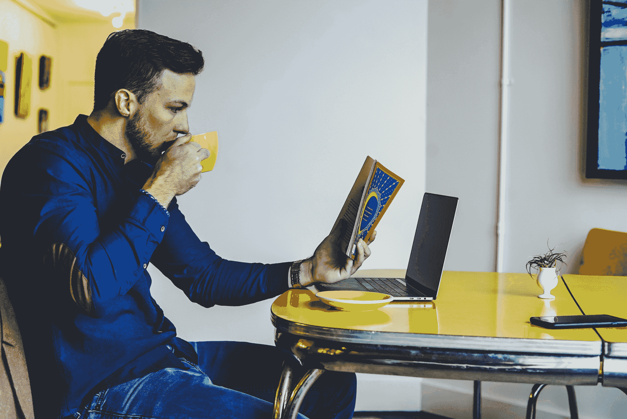 A person working at a portable office setup in a coffee shop