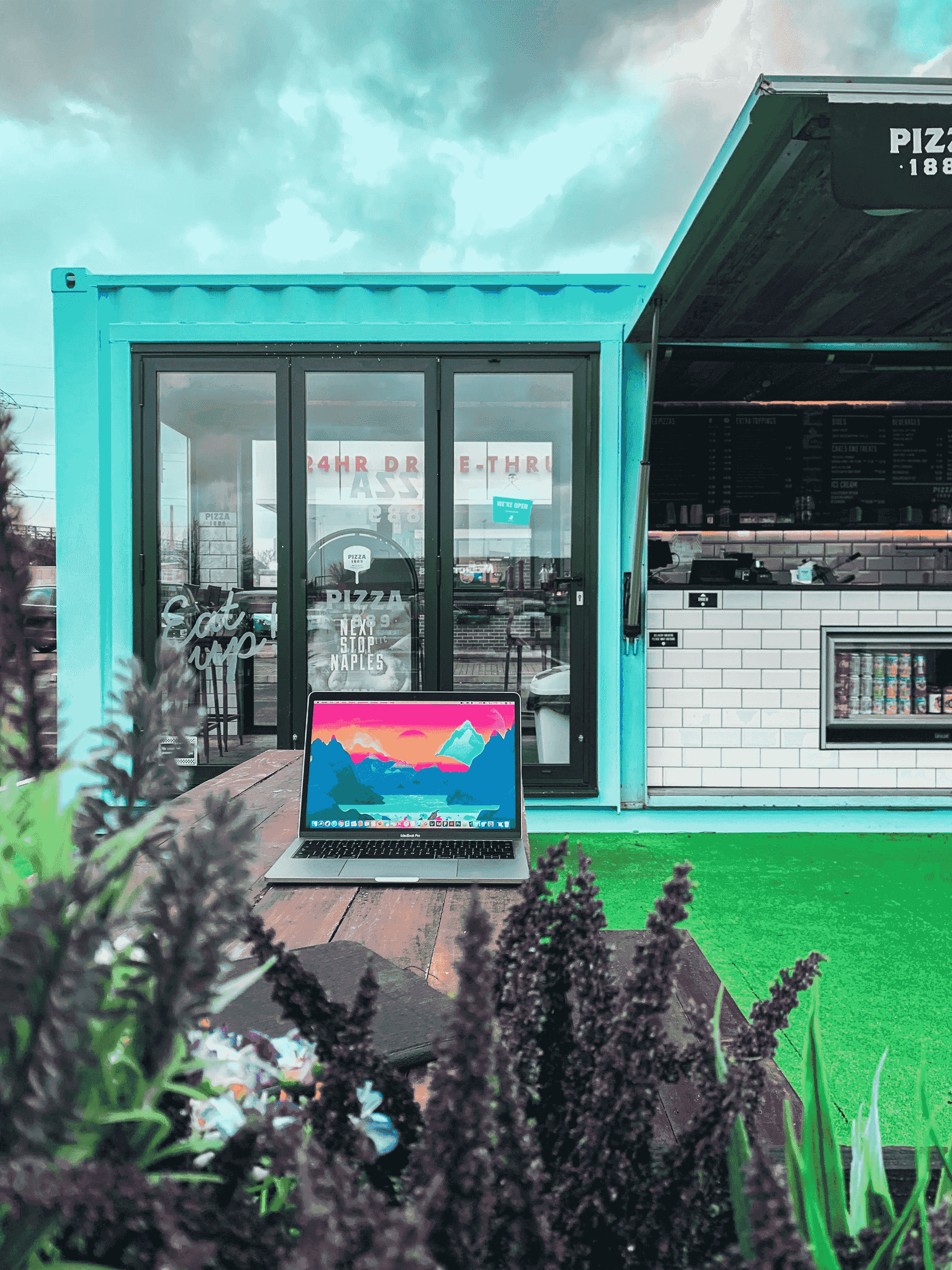 Beautiful sustainable landscaping around storage container cottage