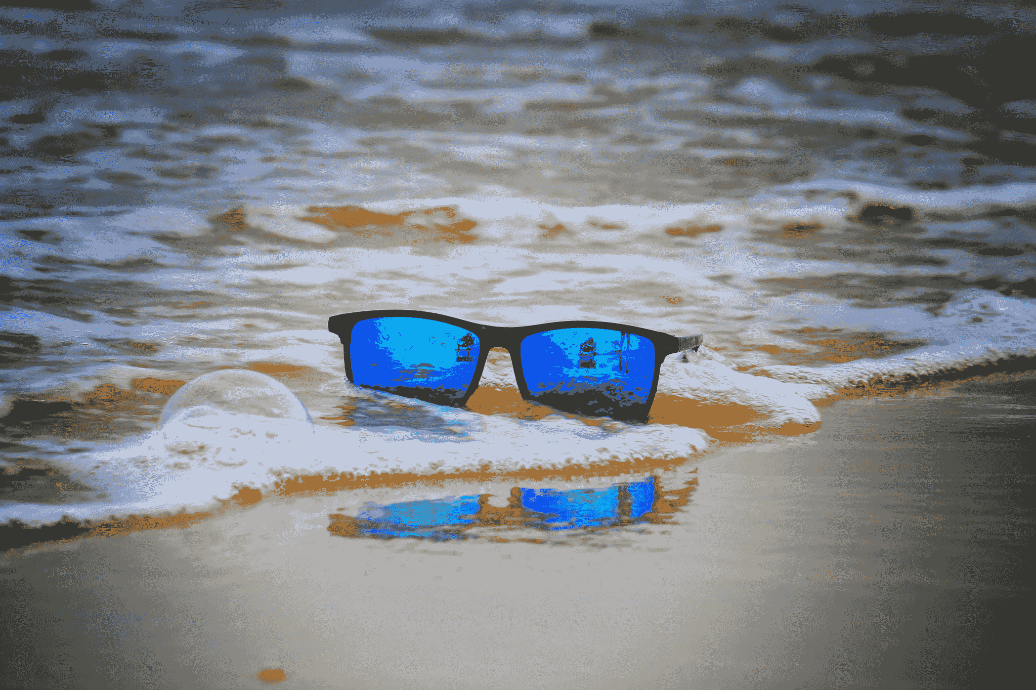 floating sunglasses polarized reflecting sunlight near water