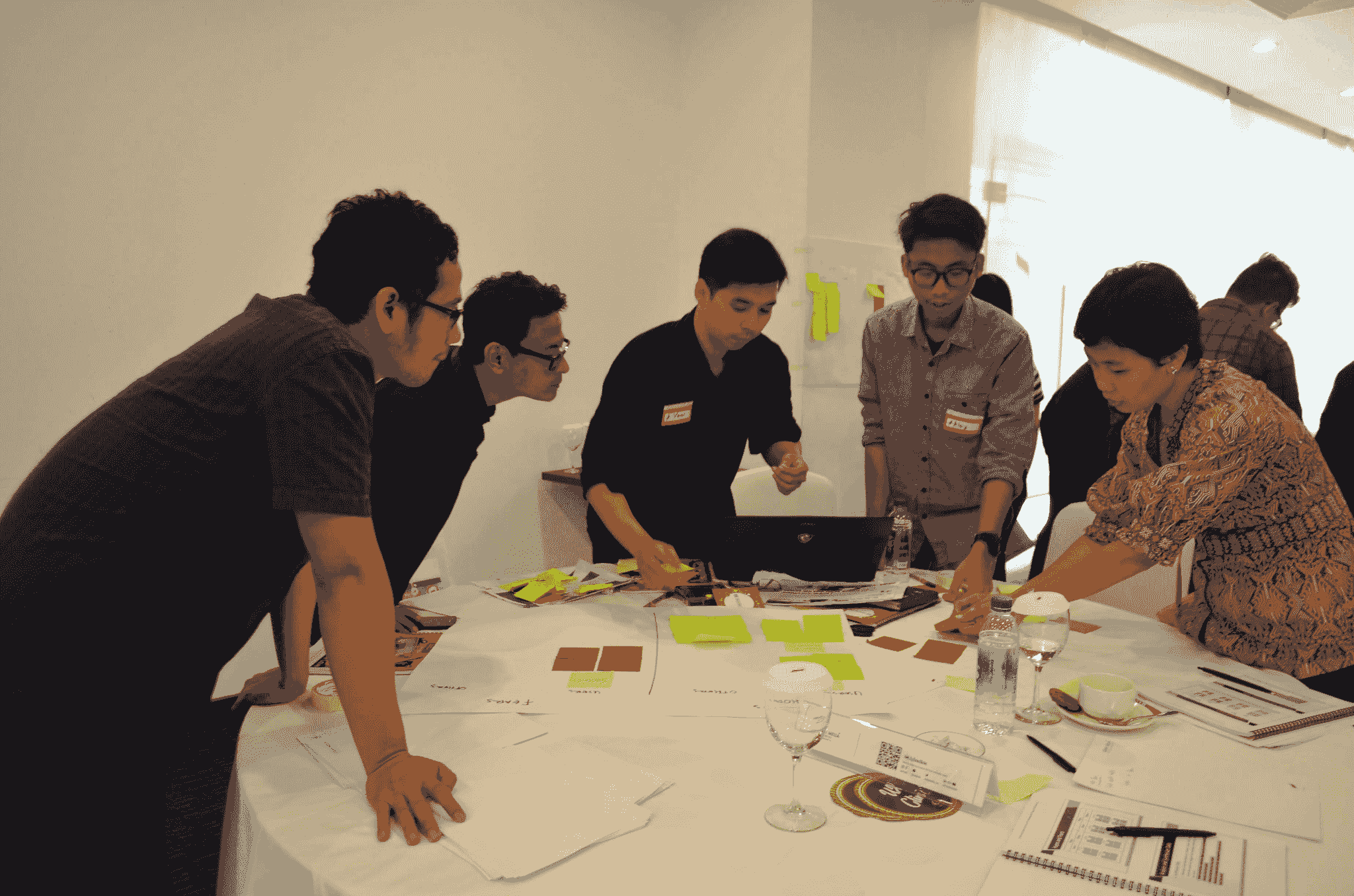 Team discussing strategies for improving Umbrella Quality Control Standards