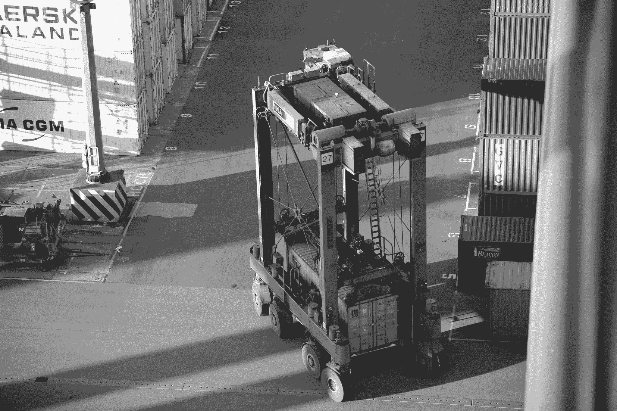 Foldable container being transported in an industrial setting